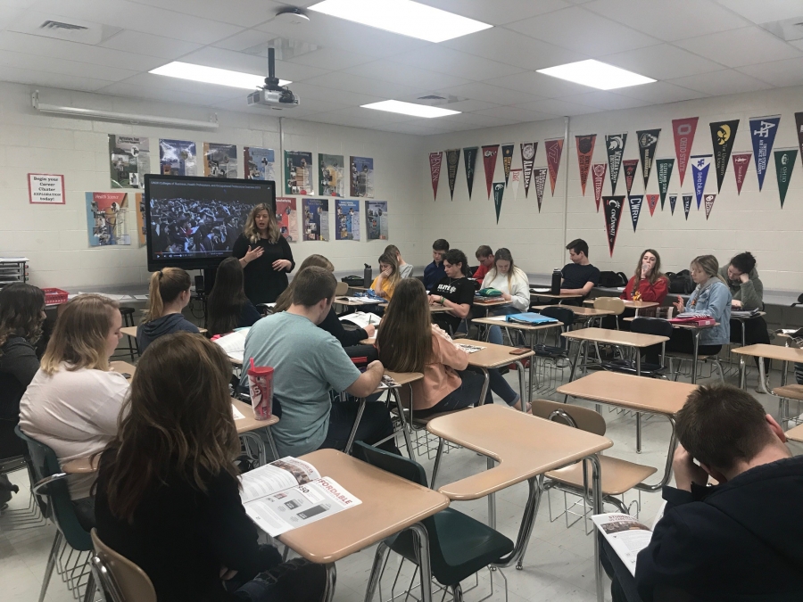 woman talking to a room full of students